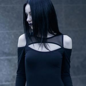 Black long-sleeved mesh and exposed shoulders